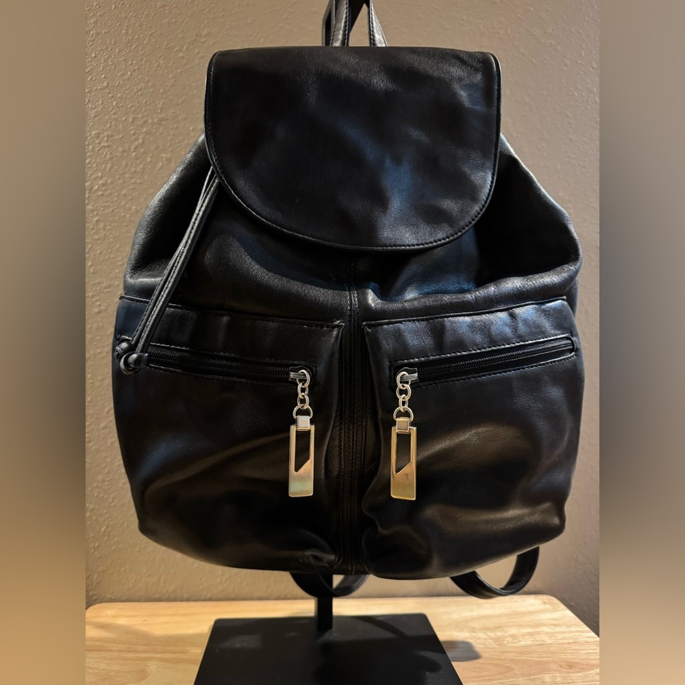 Black Leather Drawstring Backpack with Gold Accents
